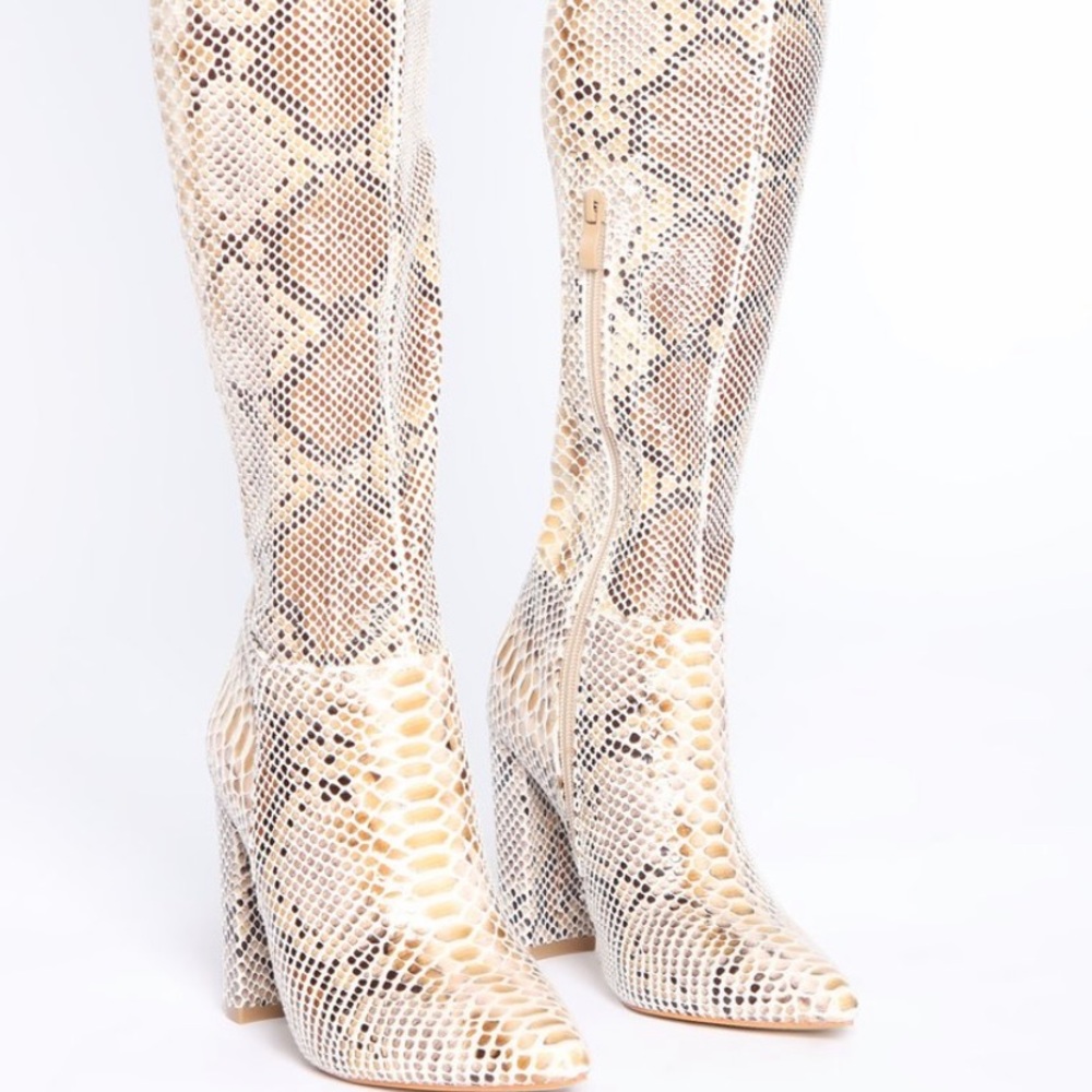 Knee high snake skin heel boots